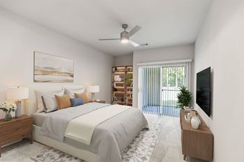 A bedroom with a large bed, a ceiling fan, and a television